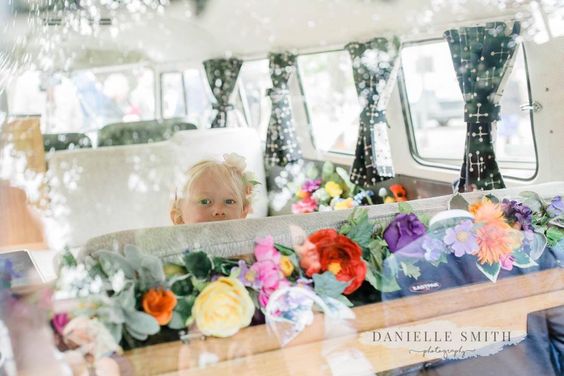 interior of wedding vw camper showing flower decorations