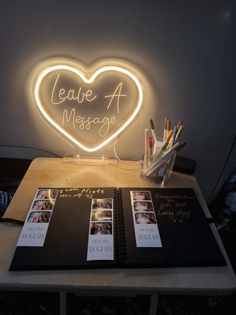 Wedding photo booth guest book with printed pictures and messages