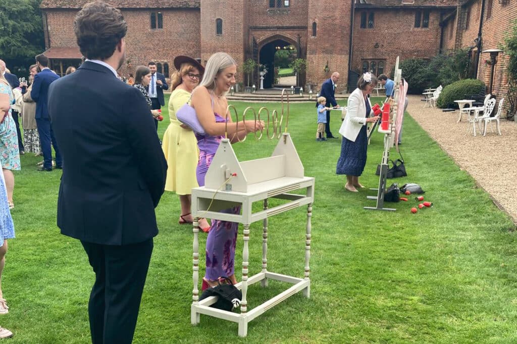 Wedding guests playing vintage games during the drinks reception