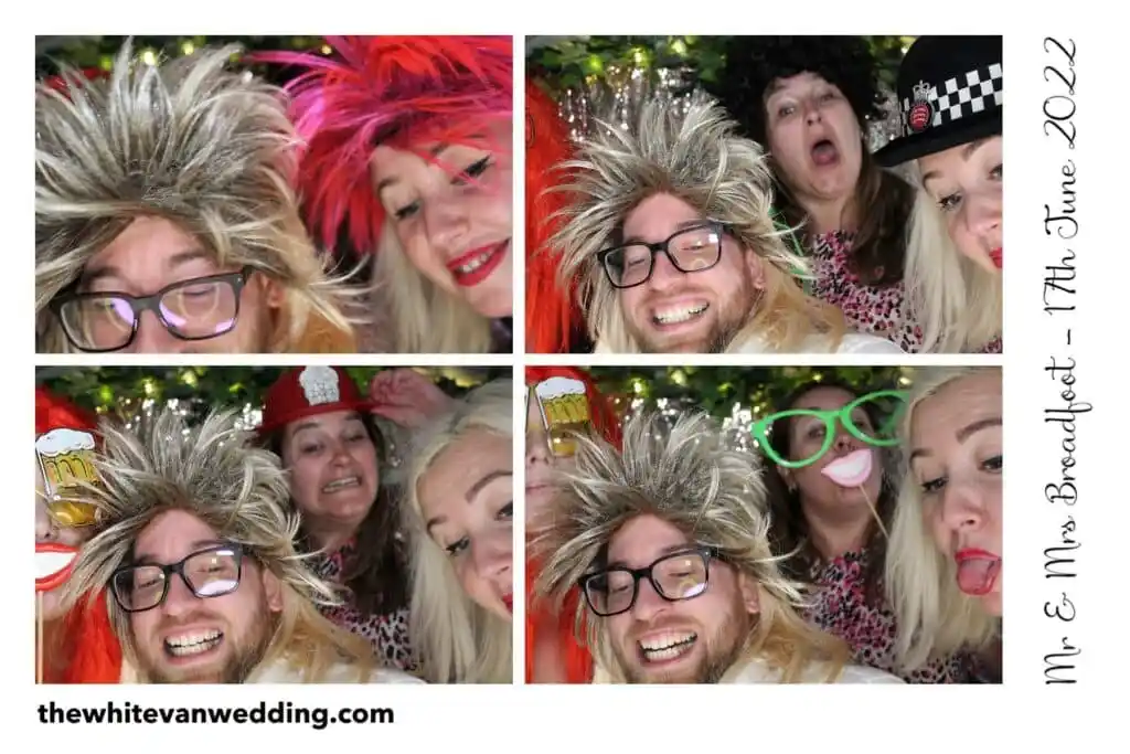 Wedding guests using colourful props in the VW campervan photo booth